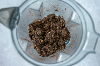 <p>In a food processor pulse the walnuts and almonds until crumb like texture.</p>