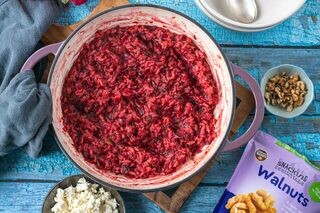 <p>Once you added the last stock and the rice is almost ready add in the grated beetroot and mix well.</p><p>Add the balsamic vinegar, nutritional yeast and season with salt and pepper to taste.</p>